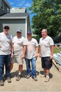 Four men working construction for Habitat for Humanity