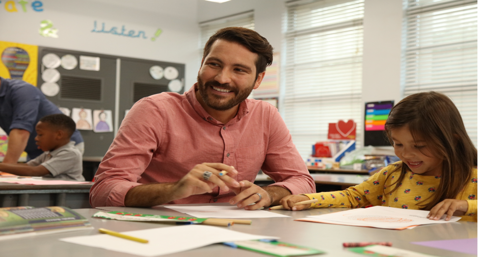 tutor teaching a child to read