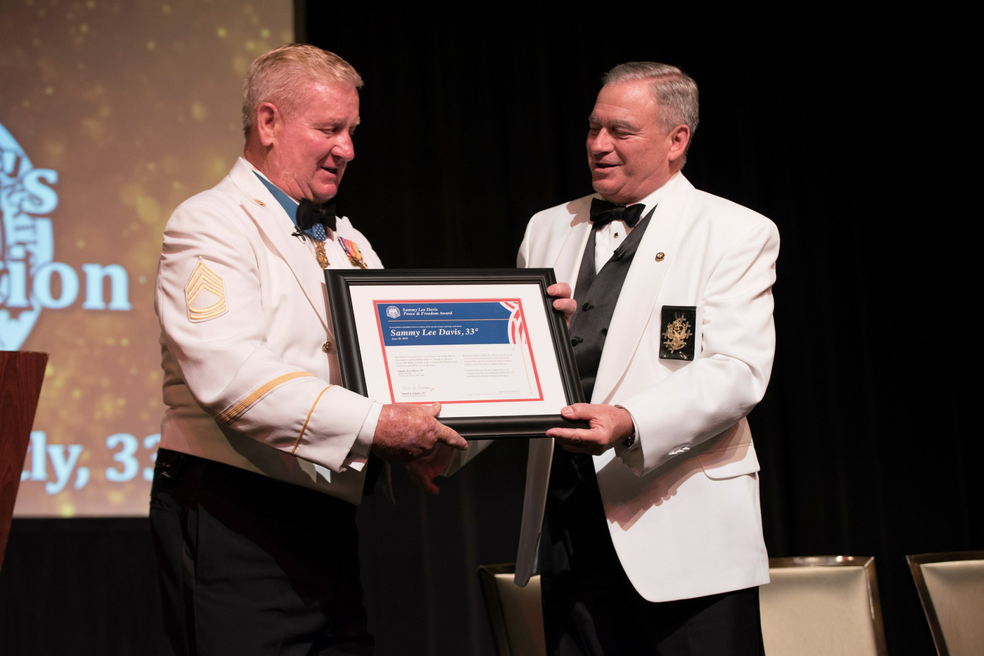 Dave Glattly presenting award to Sammy Lee Davis