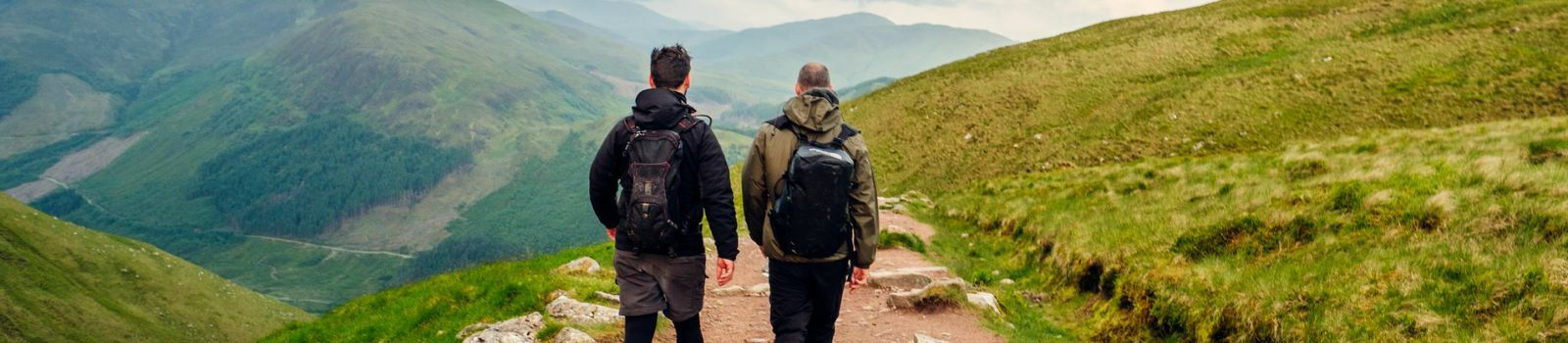 Two men hiking along a path