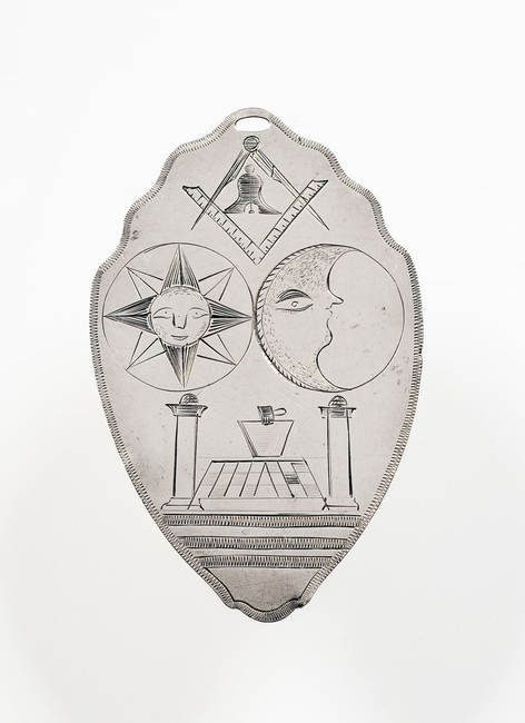 A 17th century Mark Medal shows Masonic symbols including the square and compasses and plumb bob.