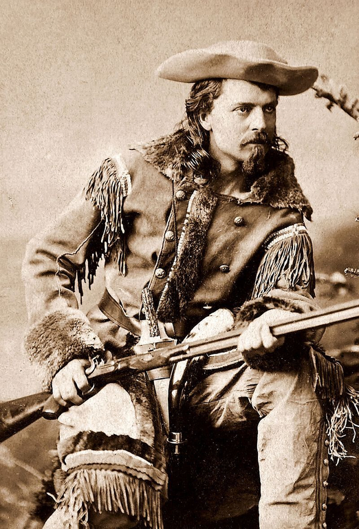 Buffalo Bill Cody poses in a frontiersman outfit with his rifle