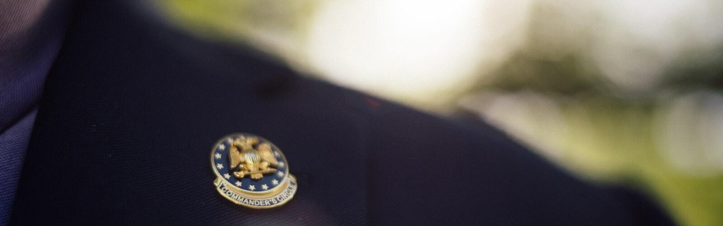 Commander's Circle Gold Pin on a Lapel