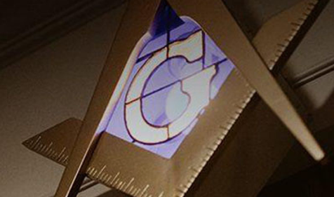 square and compass symbol with the letter G inside of it