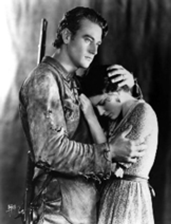A shot of John Wayne and actress Marguerite Churchill in The Big Trail; John Wayne's first role as a leading man.