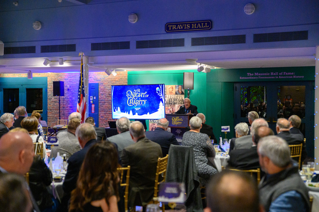 Tweed Roosevelt speaks in front of an audience at the Scottish Rite, NMJ’s Giving Tuesday event.