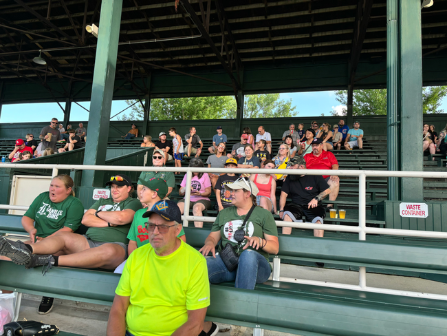 A group of friends gathered at a baseball game in Danville Stadium.