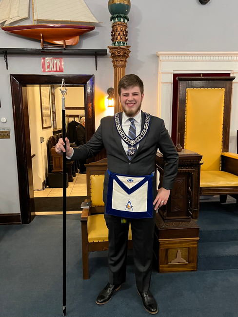 A young Scottish Rite Mason poses with Masonic regalia