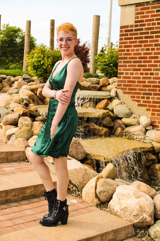 A photo of a Scottish Rite, NMJ Abbott Scholarship recipient wearing a green dress outside