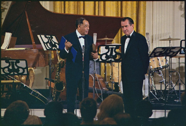 Duke Ellington stands on stage with President Richard Nixon