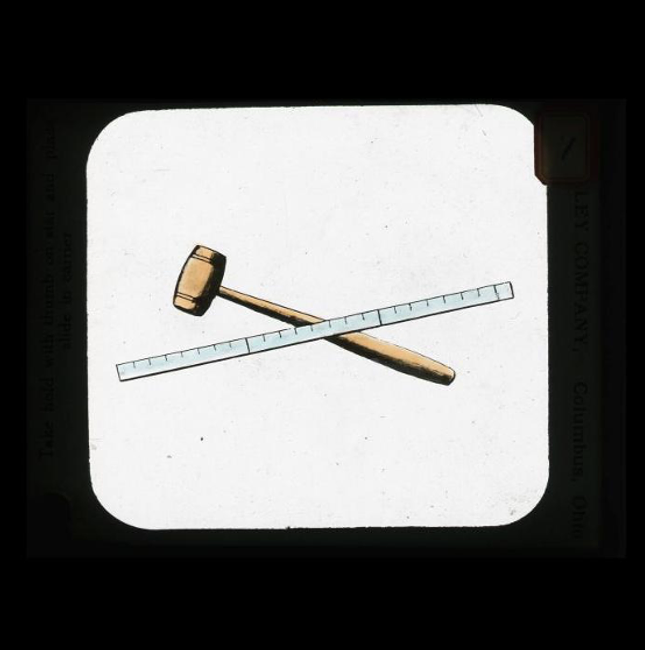 Masonic magic lantern slide showing Masonic tools, ruler and gavel