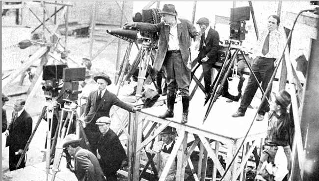 Freemason Cecil B. DeMille on set directing a scene