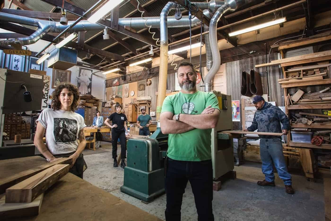 A group of people working in a woodshop