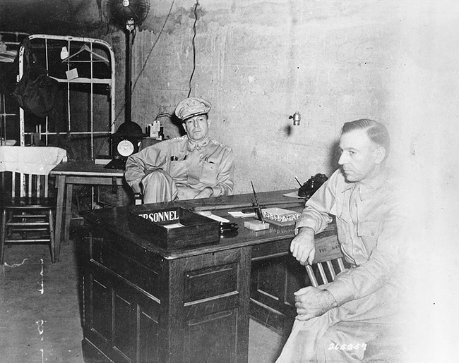 General Douglas MacArthur with Chief of Staff, Major General Richard Sutherland, in the Headquarters tunnel on Corregidor, Philippines.