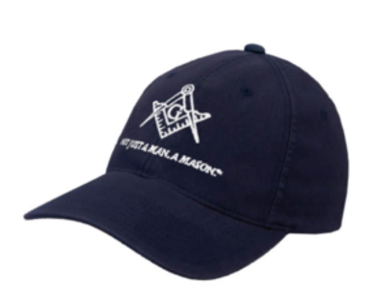 A navy baseball cap featuring the Masonic square and compasses logo and “Not Just A Man. A Mason” tagline embroidered in white, available at The Masonic Marketplace