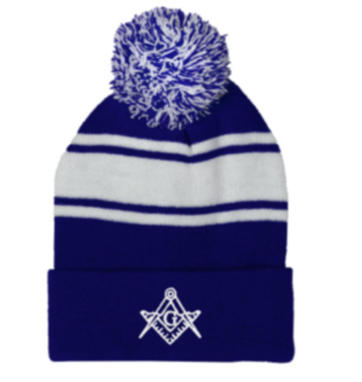 Photograph of a blue and white striped winter hat featuring a pom on top and the Masonic square and compass logo on the front, available at The Masonic Marketplace