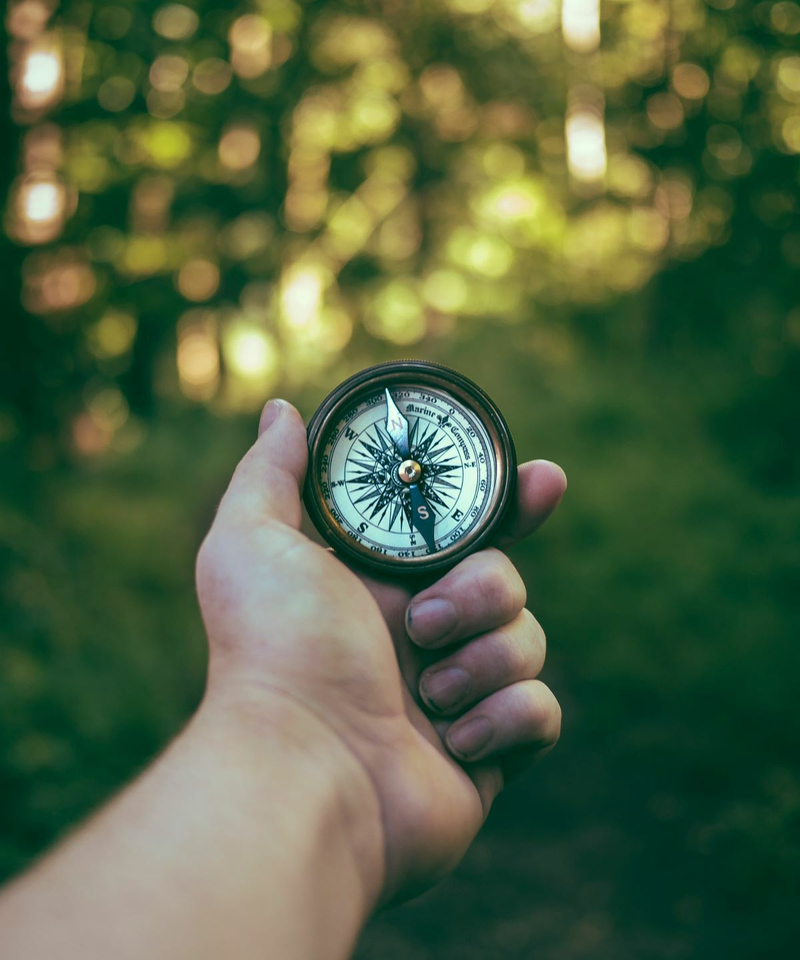 Man holding compass